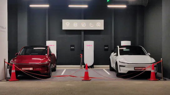 Tesla showroom Delhi Aerocity, Tesla India expansion 2025, Tesla Model Y price India, Tesla Supercharger Delhi NCR, Tesla charging network India, Tesla V4 Supercharger range, Tesla Model Y variants India, Tesla EV showroom locations, Tesla Destination Charging India, Tesla Aerocity Delhi launch